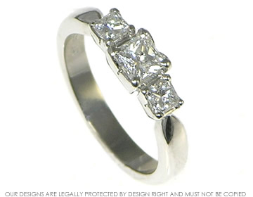 Bespoke platinum and diamond trilogy engagment ring.