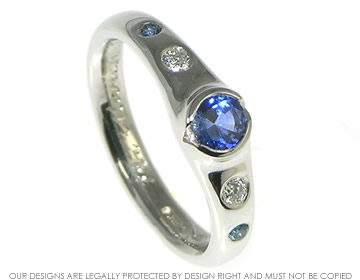 Platinum  engagement ring with a cornflower blue sapphire