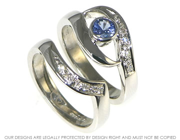 Bespoke 9ct white gold twist engagement ring with 4.6mm brilliant cut blue sapphire.