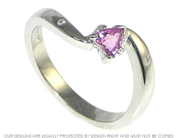 Bespoke 9ct white gold engagement ring with heart shape sapphire.