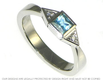 Bespoke platinum engagement ring with a Swiss blue topaz and diamonds