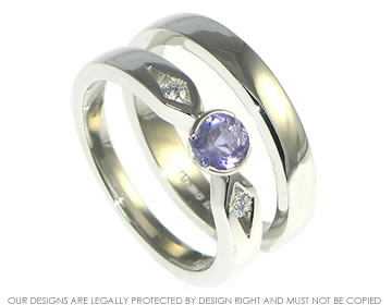 A lovely sapphire and diamond engagement and wedding ring set.