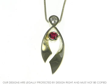 Bespoke 9ct white gold, ruby and diamond pendant and earrings set.