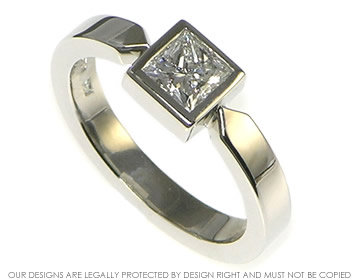 Modern platinum H VS 0.62ct princess cut diamond engagement ring 