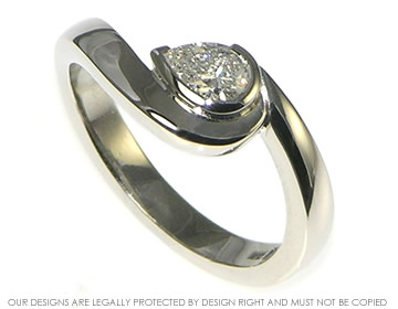 Palladium and pear shape 0.36ct H SI  diamond aymmetrical twist engagement ring.