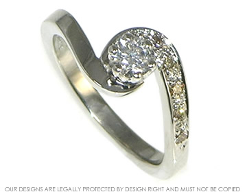 Platinum twist ring with a white  diamond and cognac
shoulder diamonds