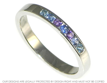 Bespoke 9ct white gold eternity ring with blue sapphires.