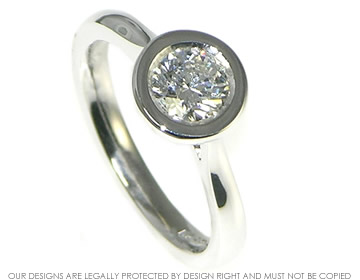 Platinum 0.72ct E SI1 diamond solitaire engagement ring with open tip design