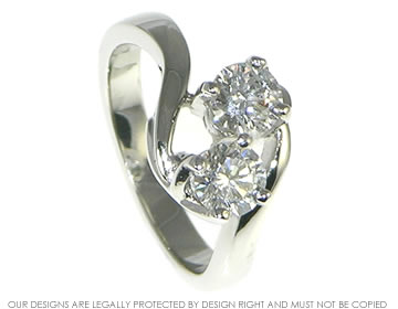 Bespoke platinum engagement ring with a pair of brilliant cut diamonds