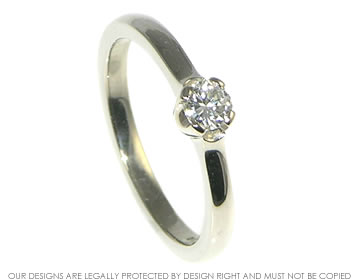 Bespoke fairly traded white gold engagement ring with a recycled diamond