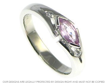 Platinum dress ring with a marquise cut pale pink sapphire