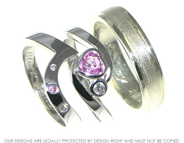 A pair of white gold wedding rings with contrasting finishes. 