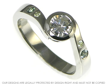 Platinum, diamond and green sapphire engagement ring