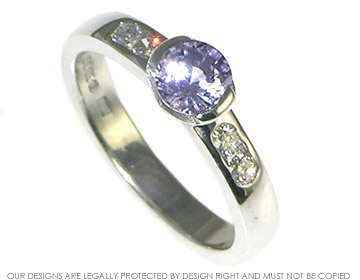 9ct white gold and 0.59ct brilliant cut lilac sapphire and diamond engagement ring