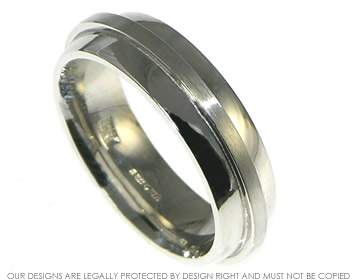 Man's platinum wedding band with overlayed metal