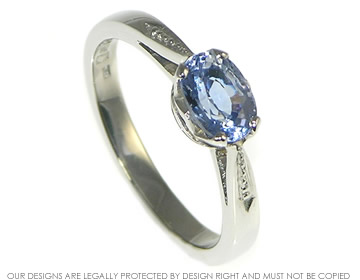 Palladium and blue sapphire engagement ring