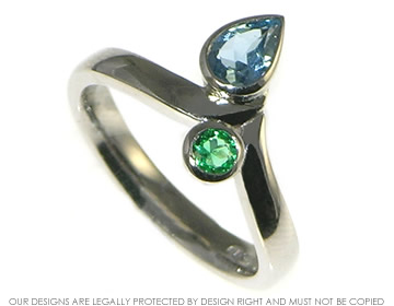 Palladium aquamarine and  emerald engagement ring. 