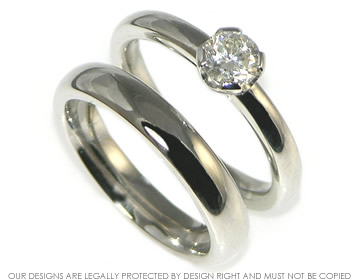 Bespoke platinum solitaire engagement with a recycled diamond.