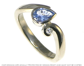 Bespoke 18ct white gold engagement ring with a pear shaped sapphire