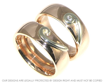 A pair of 9ct rose and white gold wedding rings. 