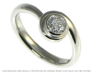 Bespoke Platinum and diamond curl  design engagement ring.