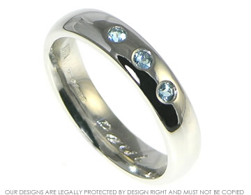 Platinum band  with three aquamarines. 