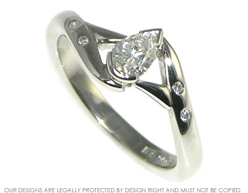 Platinum and pear cut diamond engagement ring