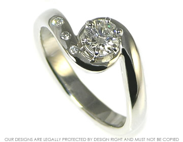 Twist style platinum and diamond engagement ring