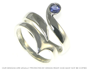 Fitted Silver engagment and wedding ring with a blue Sapphire.