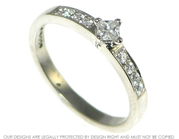 Palladium and 0.17ct princess cut diamond engagement ring both claw and pave set. 