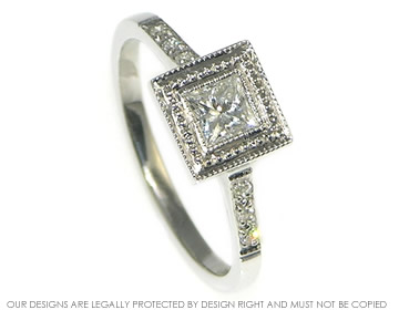 A 9ct white gold engagement ring with a princess cut diamond. 