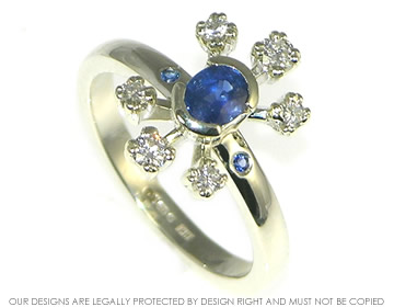 Bespoke 9ct white gold, blue sapphire and diamond multi stone ring.