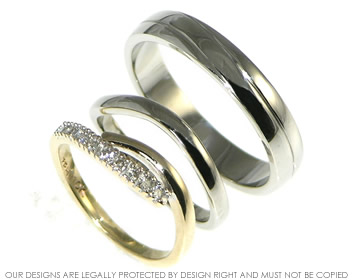 Palladium wedding rings with engraved detail.