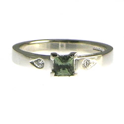 18ct white gold, 0.40ct natural african green sapphire and grain set diamond engagement ring