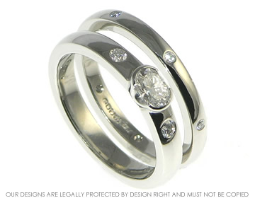 Palladium wedding band with seven brilliant cut diamonds. 