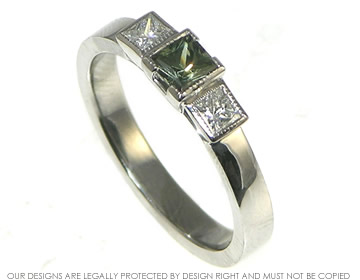 Bespoke palladium, green sapphire and diamond trilogy engagement ring.