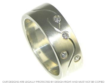 Bespoke silver and diamond dress ring with engraved detail.