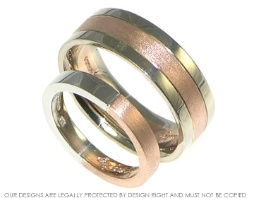 A pair of bespoke white gold and rose gold wedding rings.