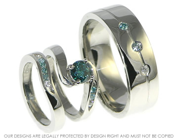 A pair of bespoke platinum blue and white diamond wedding rings. 