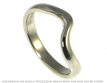 Delicate 18ct white gold wave inspired band with a polished finish