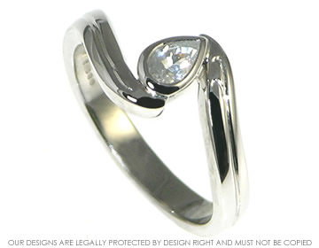 White gold engagement ring inspired by swirling water