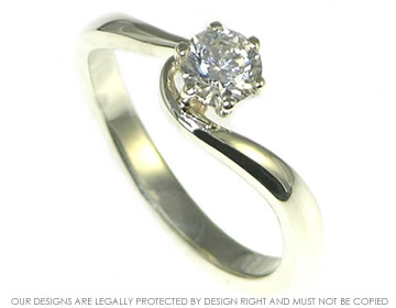 9ct white gold twist style engagement ring with a brilliant cut diamond