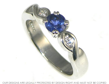 Bespoke palladium, sapphire and diamond engagement ring.