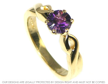 18ct yellow gold celtic inspired laser cut deep amethyst eternity ring.