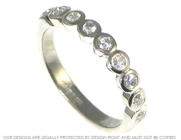 Platinum eternity ring with 9 brilliant cut diamonds in all around settings