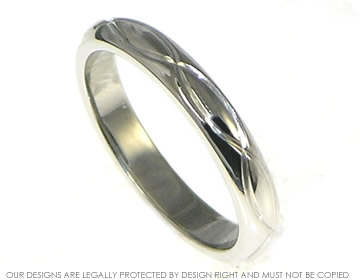 Bespoke palladium wedding ring with a double wave engraved detail