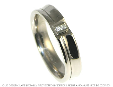 18ct white gold ~5.5mm wide concave wedding ring with two brilliant cut diamonds.