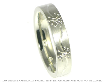 Daisy inspired combined engagement and wedding band.