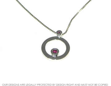 9ct white gold ruby pendant on chain. 