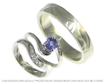 A pair of 9ct white gold wedding rings. 